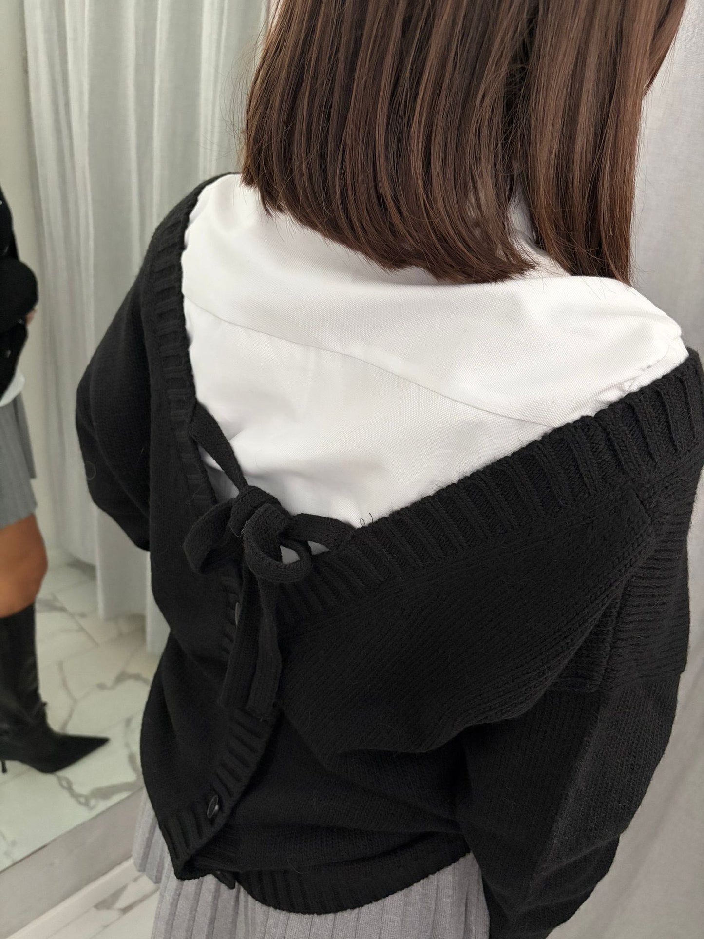 CARDIGAN NERO CASTONI FIOCCO